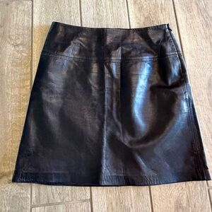 Cache Black Leather Mini Skirt with side zipper.